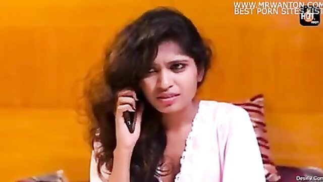 Curvy Indian beauty in sheer robe on phone, teasing cleavage closeup