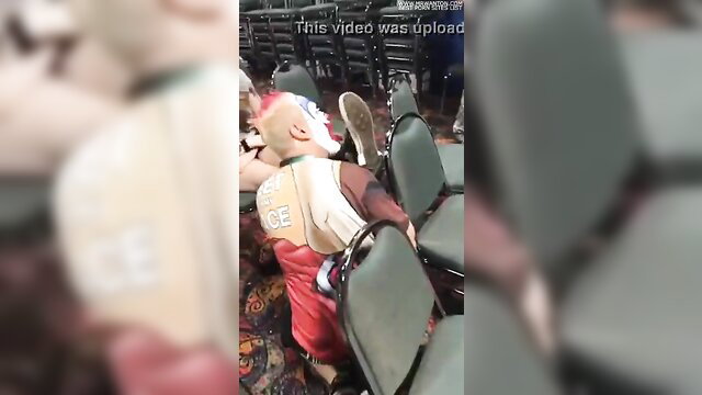 Clown in Converse sneakers worshipped in arena seats fetish scene