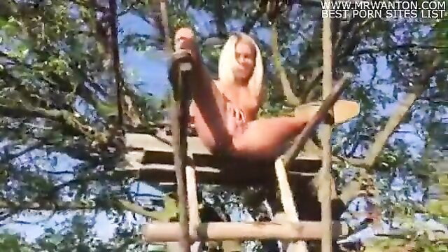 Claudia Macc blonde spreads legs on treehouse in bikini, public pee tease