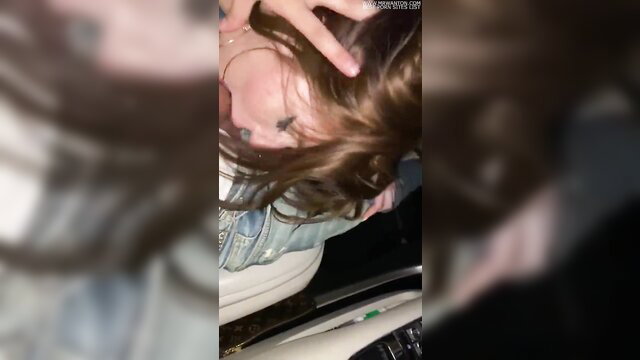 Blurry brunette amateur in car giving public blowjob, leaked snap