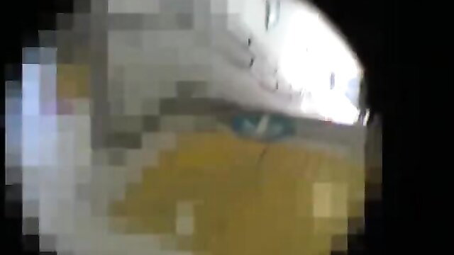 Blurry JAV thumbnail of nude Asian woman lying on yellow sheets