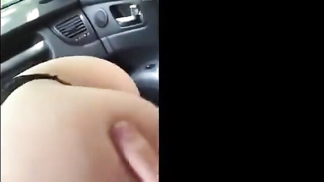 Closeup of woman's pale big ass and hand in car POV