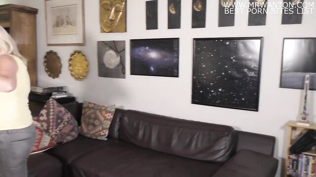 Blonde MILF in tank top and pants poses naughty with neighbor's son