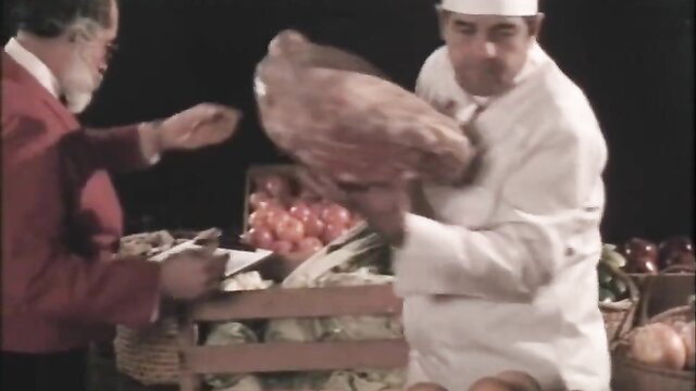 Vintage 1986 Lust on the Orient Xpress chef holds raw meat in market