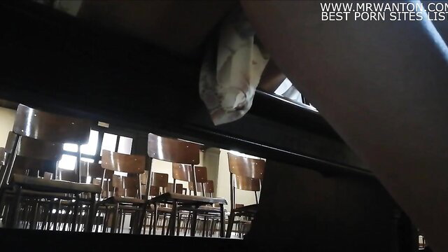 Dominant figure exposes cock over church chairs in blasphemous scene