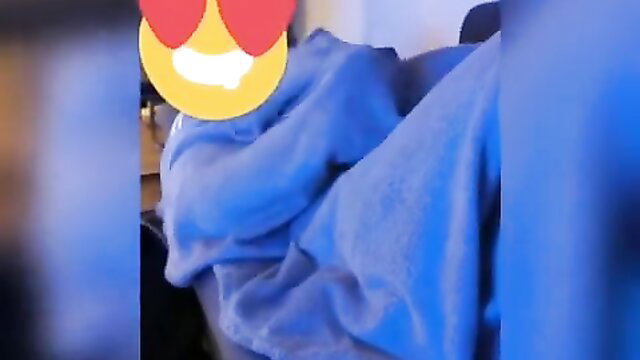 Blurry closeup of woman in blue towel with heart eyes emojis, teasing naughty vibe