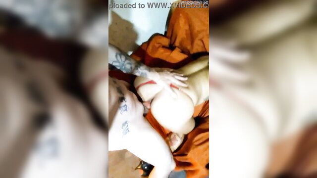 Blurry closeup of pale big tits and hands in amateur tittyfuck