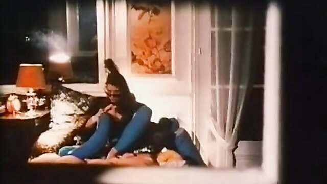 French Infernal 1983 brunette in jeans lounging seductively on bed