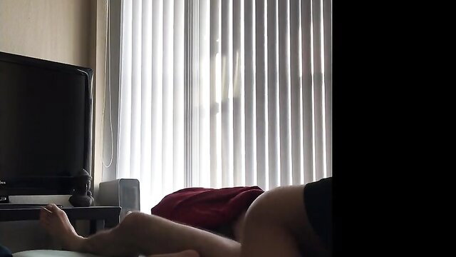 Nude Korean woman lying on bed, bare ass and feet visible