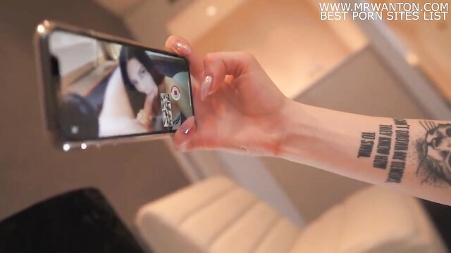 Tattooed babe holds phone filming creampie escort pussy closeup