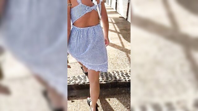 Hot babe flashing striped mini dress outdoors in Lanzarote