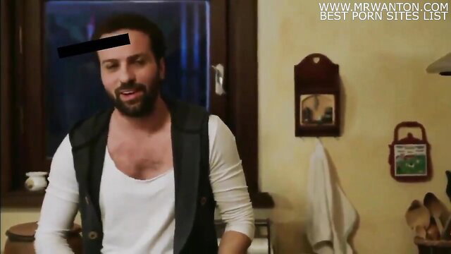 Turkish man in kitchen with open vest exposing chest in sex scene