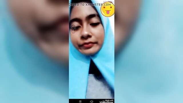 Closeup of smiling Indonesian hijab girl with tongue out emoji