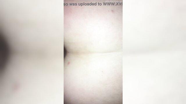 Blurry closeup of woman's pale ass and thighs ready for cock