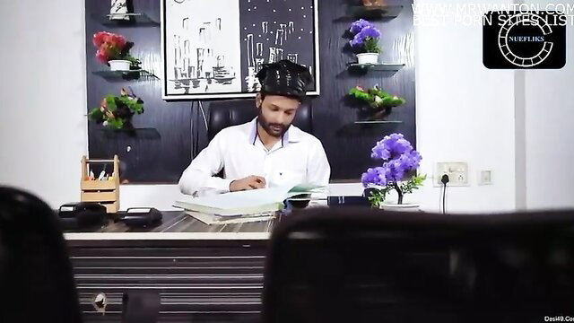 Handsome Desi man in white shirt at Nuru Massage Parlor desk Episode 1