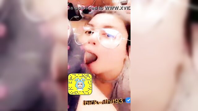 Glasses-wearing thick Latina-Asian mix with tongue out, mouth fucked hardcore