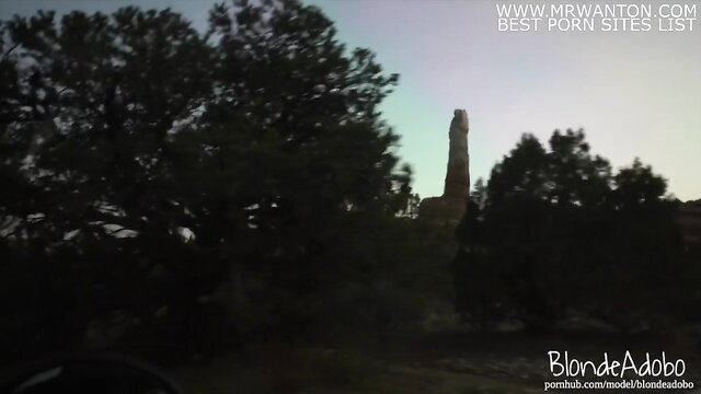 Blonde hiker at rock tower sunset, sexy camping tease