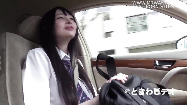 Japanese schoolgirl in car, black hair, smiling eyes closed ecstasy
