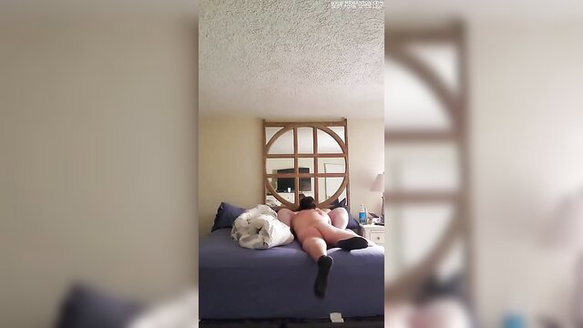 Loud BBW lying nude on bed with legs spread getting pleasured