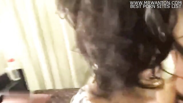 Curly-haired Asian beauty in cosplay teases with cleavage closeup