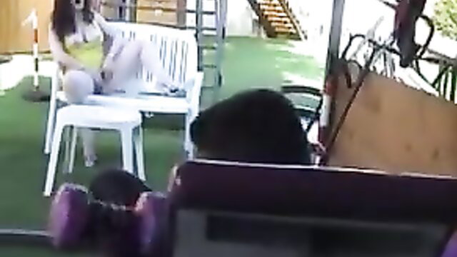 Jessica Rizzo in yellow top white skirt huge tits on balcony