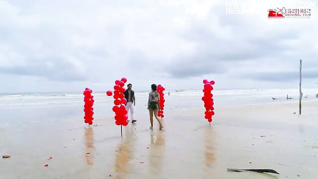 Hot Indian couple Tharki Sir web series beach walk with red balloons