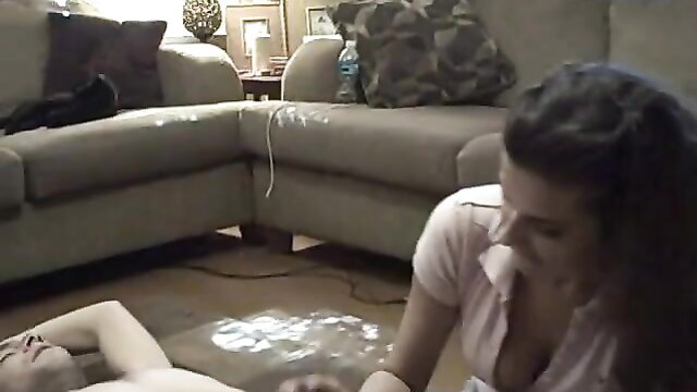 Brunette girlfriend teases stranger with handjob on living room floor