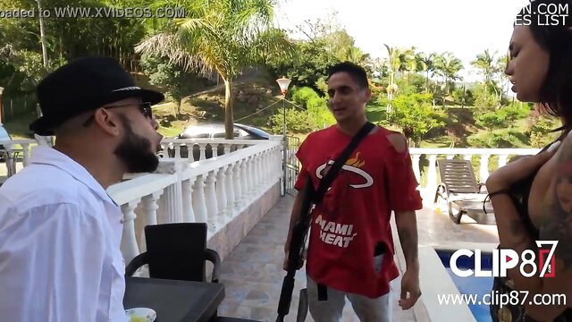 Colombian sluts with narco in red NAMI shirt holding AK47 outdoors