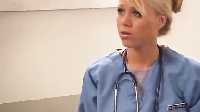 Blonde Katie Morgan in tight nurse scrubs with stethoscope