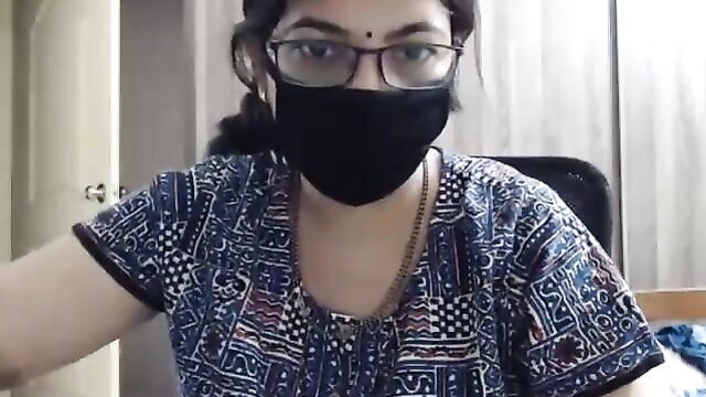 Indian MILF in glasses and mask on webcam, teasing strip