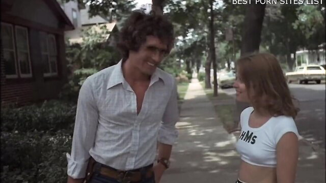 Vintage cheerleaders movie: hairy guy flirts with busty teen in Hooters top on street