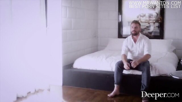 Sexy man in white shirt sits on bed in Deeper sexy thumbnail