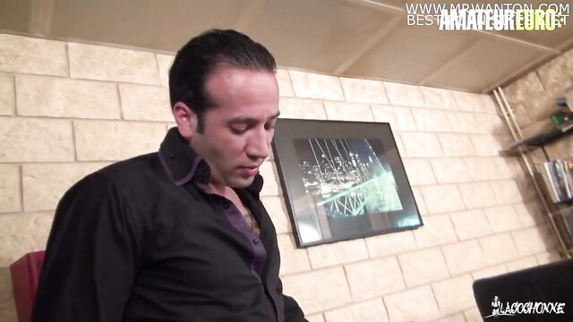 Man looking down, possibly in a bedroom