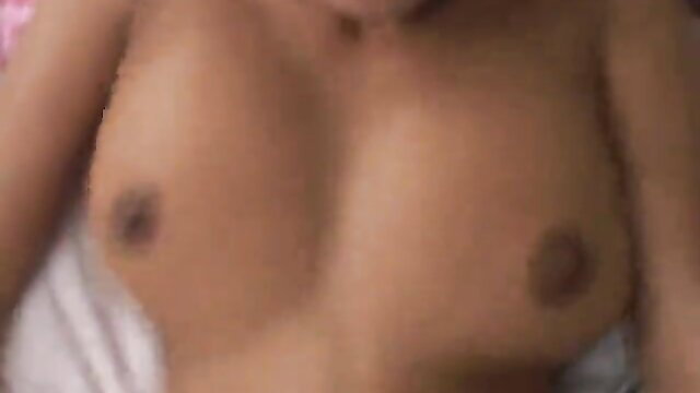 Blurry closeup of young Asian girl's perky bare tits and nipples