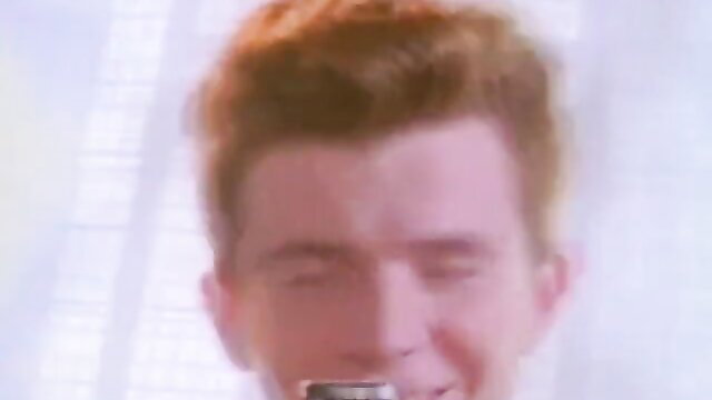 Hot redhead with fiery hair smiling in steamy solo tease