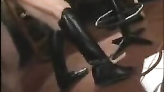 Hot babe in shiny black thigh high boots posing seductively