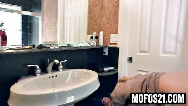 Bailey Brooke bent over sink, juicy ass out in tight skirt