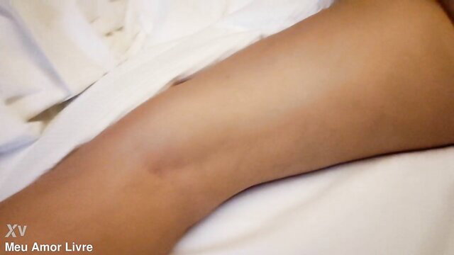 Amateur wife lying nude on bed showing thigh in hotel room