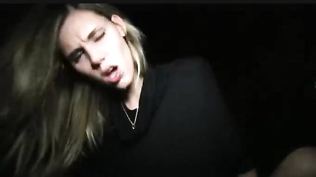 Blonde babe in black turtleneck moaning passionately closeup