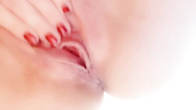 Close-up red nails spreading wet pink pussy lips in orgasm tease