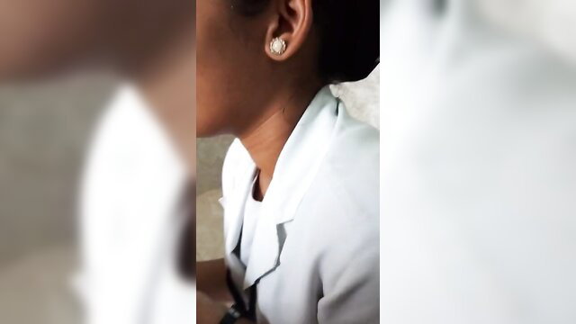 Closeup of Malayalam Tamil girl's pearl earring and neck in white blouse
