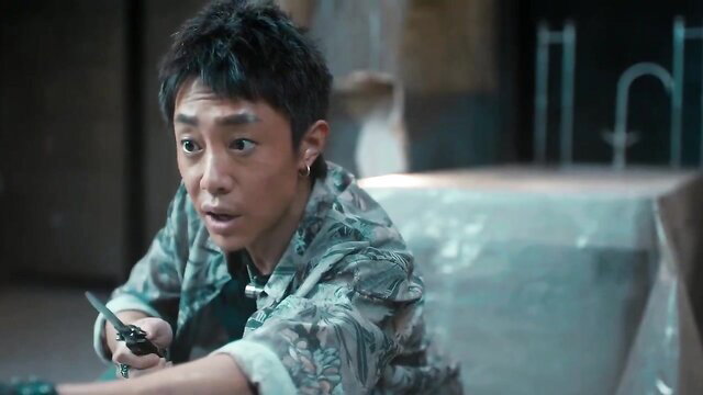 Asian twink in camo shirt holds knife in tense BDSM JAV scene