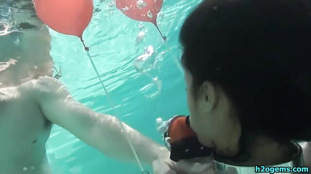 Underwater BDSM nipple pullers on Drea with balloons in pool