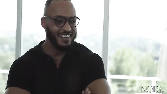 DeAngelo Jackson smiling in black shirt gay porn thumbnail