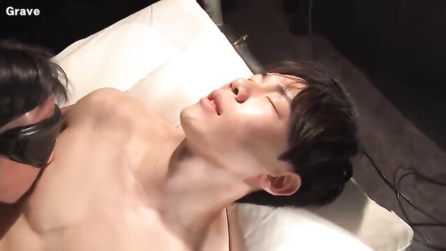 Blindfolded Asian twink kissed passionately by muscular top in gay porn