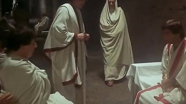 Caligula II ancient Roman orgy scene with robed men and women