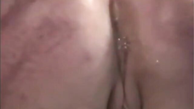 Closeup lesbian enema BDSM with fluid expulsion and spanking marks