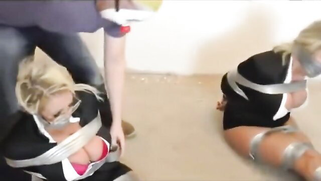 Two busty blonde secretaries bound, gagged and taped in skimpy black dresses