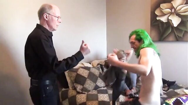 Priest and Joker costumed man grope toddler on couch in Ariel’s family album