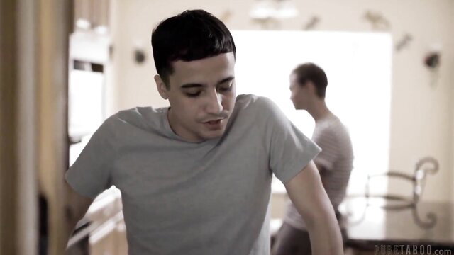 Grieving stepmom in gray tee seeks comfort from two young Latino sons in kitchen